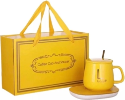 Elektrisk drikkevarmeplade med gul kop og ske