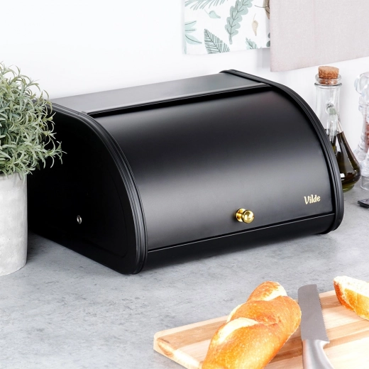 Praktisk rullende låg med gylden knop