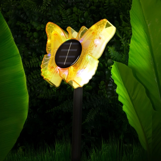 Farverig dekoration til blomsterbedet