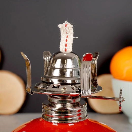 Justerbar væge for optimal flamme