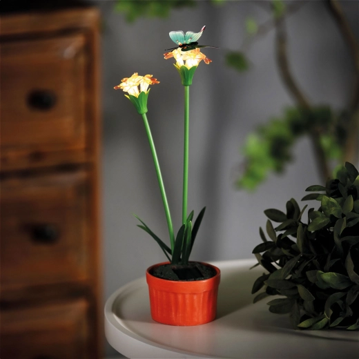 Farverig solcelleblomst med varmt hvidt LED-lys, rød