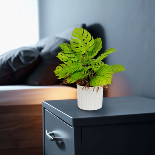 Dekorativ kunstig monstera i urtepotte
