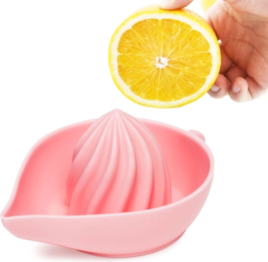 Lyserød silikoncitruspresser