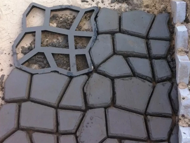 Form til betonbelægningssten kattehoved