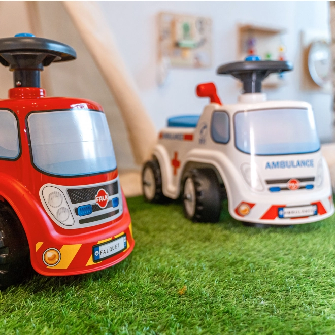 FALK Løbecykel Ambulance med åbent sæde og horn på rattet