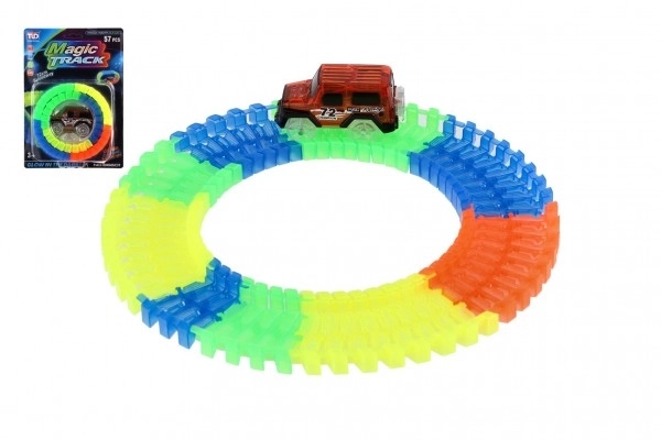Skinne der lyser i mørke + batteridrevet bil i plast 57 dele længde 72 cm på kort 17x24x7 cm